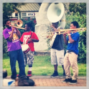 A brass band play's along the Mississippi River in the French Quarter.